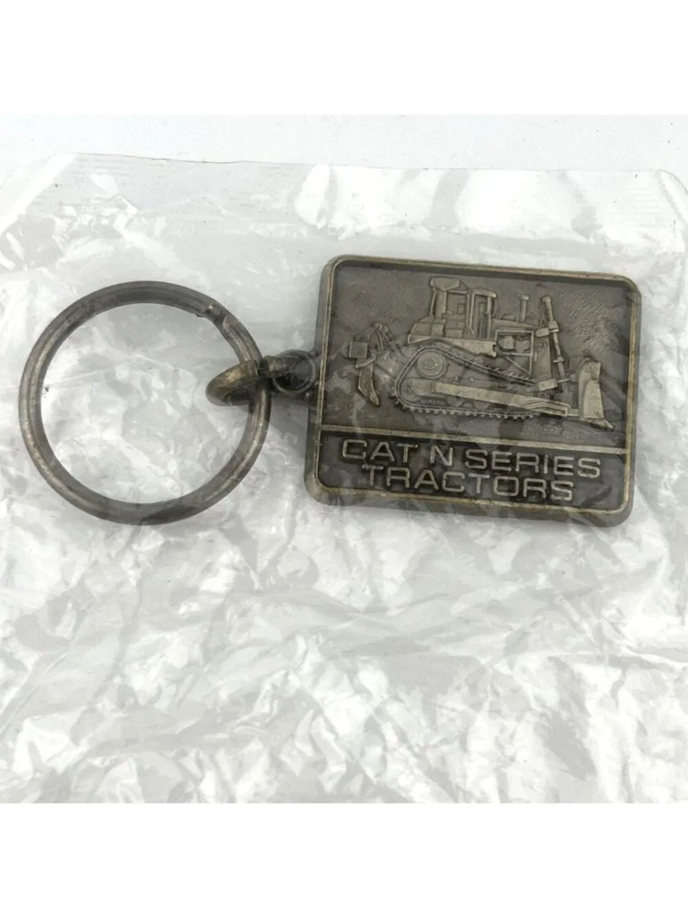 1986 Caterpillar Cat N Series Tractor Keyring Keychain NOS In original Package